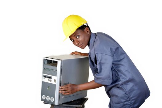 Young computer worker is in the process of maintaining a central computer unit in the workshop.