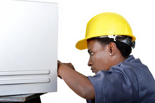 Close-up of a young woman doing the maintenance of a desktop computer.