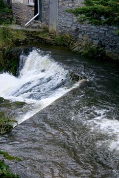 A small mountain stream with a strong current
