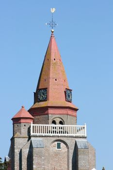 Red Tower with blue sky in the background