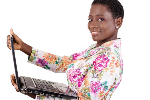 This young businesswoman loves to work with her laptop everywhere as it is very convenient