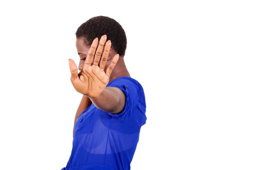 Young woman asking to stop filming her by waving her hand.