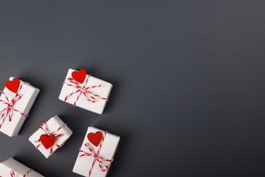 Valentine's day Concept, flat lay top view, White Gift Box and Red Heart on Gray background with copy space for your text