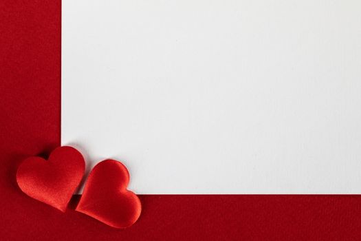 Valentine's day white blank paper greeting card and red silk hearts, background border frame with copy space, love concept