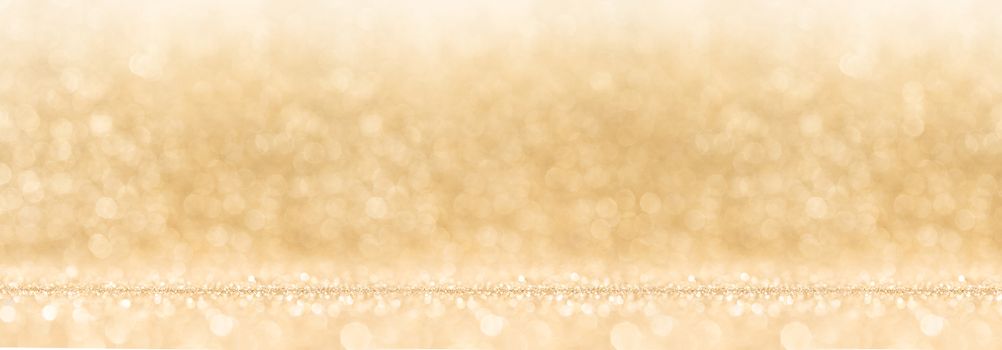 Shiny golden bokeh glitter lights abstract background, Christmas New Year party celebration concept