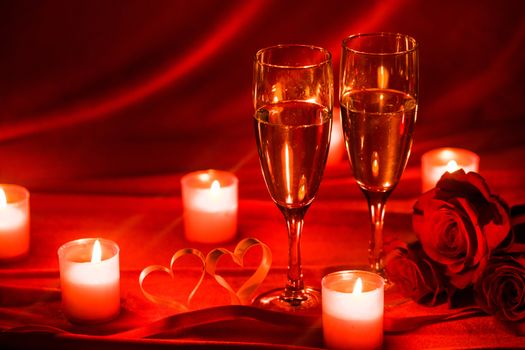 Valentines day background with champagne glasses roses candles and hearts