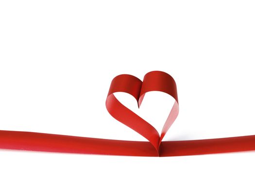 Heart shaped red ribbon isolated on white background