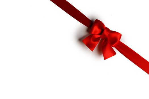 Red satin ribbon bow isolated on white background