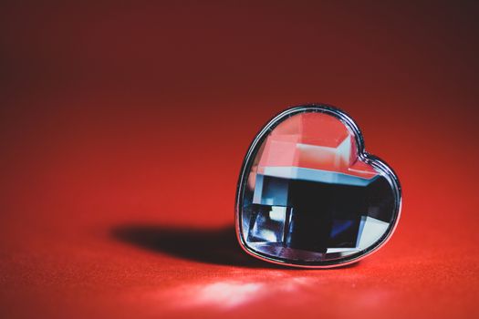 One jewel heart on red background Valentine day concept