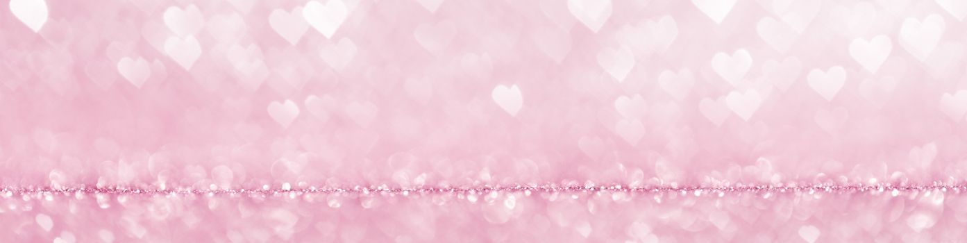 Shiny pink heart love bokeh glitter lights abstract background, Valentine's day party celebration concept