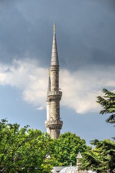 Istambul, Turkey – 07.12.2019. Minarets of the mosque of Hagia Sophia in Sultan Ahmed Park, Istanbul, Turkey, on a cloudy summer day