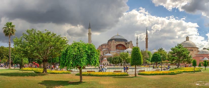 Istambul, Turkey – 07.12.2019. The Sultan Ahmad Maydan water fountain with the Hagia Sophia museum in background on a cloudy summer day, Istanbul, Turkey