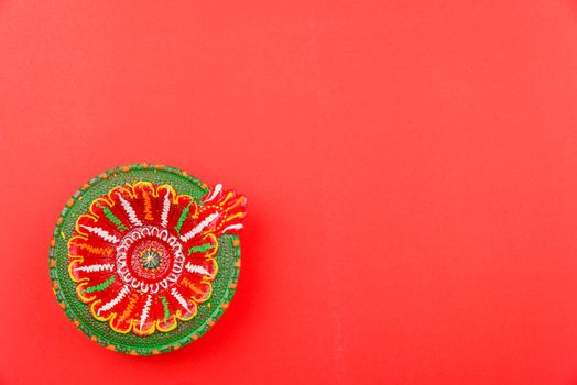 Happy Diwali Day, Flat lay top view Colorful Clay Diya lamps on red background and copy space for your text
