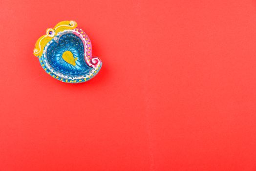 Happy Diwali Day, Flat lay top view Colorful Clay Diya lamps on red background and copy space for your text