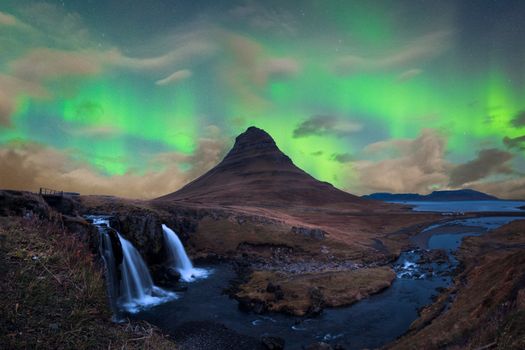 Green Aurora Borealis over Kirkjufell in Snaefellsnes in Iceland