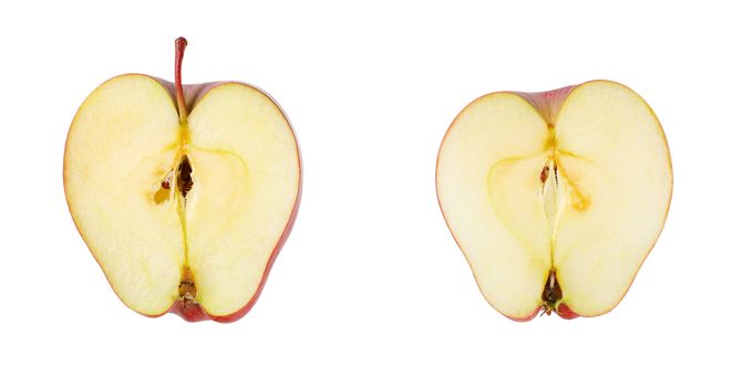 halved red apple on white background