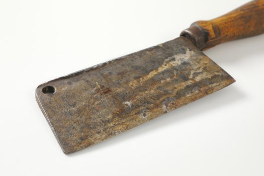 Old rusty chopping knife with wooden handle