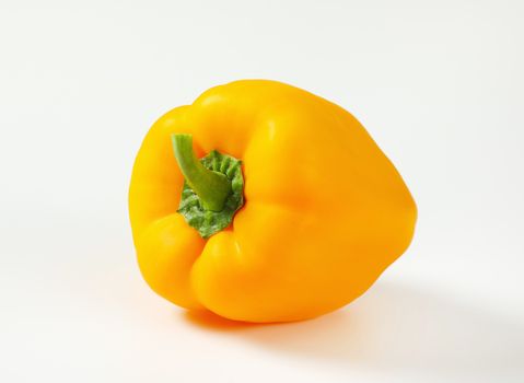 Whole ripe orange bell pepper