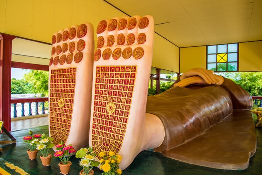 Buddha's feet statue in temple of Thailand