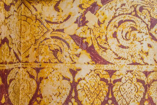 Thailand ancient striped on the wall.Temple of Thailand.