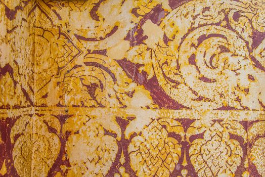 Thailand ancient striped on the wall.Temple of Thailand.