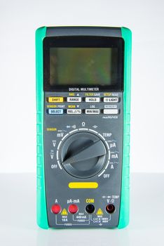 Electric multimeter on white background