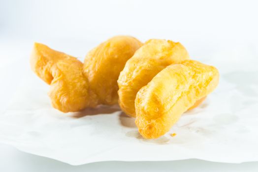 deep fried dough stick on white background, fried bread