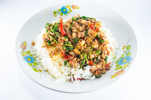 Fried pork and basil on white background.