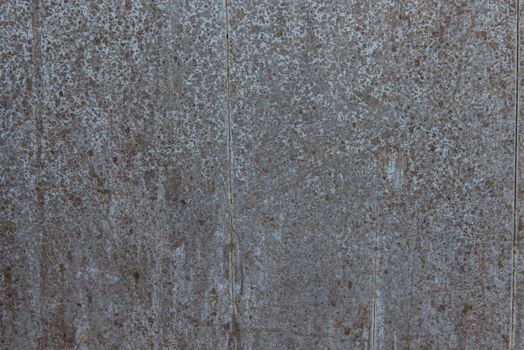 Oil slick on old wooden door for background.