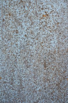 Oil slick on old wooden door for background.