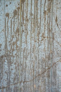 Oil slick on old wooden door for background.