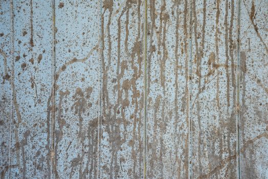 Oil slick on old wooden door for background.