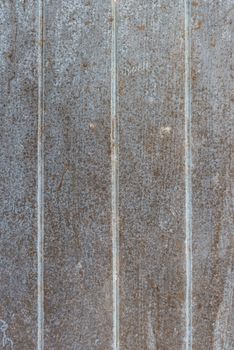 Oil slick on old wooden door for background.