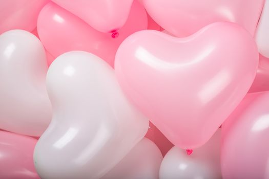 Happy valentines day greetings many heart shaped pink and white balloons background