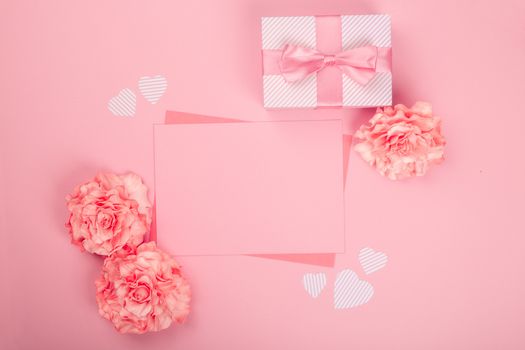 Valentines day pink background with blank love letter with copy space gift box and rose flowers