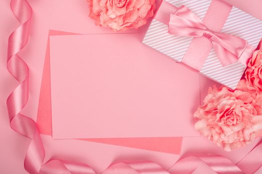 Valentines day pink background with blank love letter with copy space gift box and rose flowers