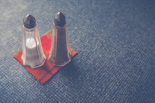 Salt And Pepper Shakers On A Retro Plastic Diner Table With Copy Space