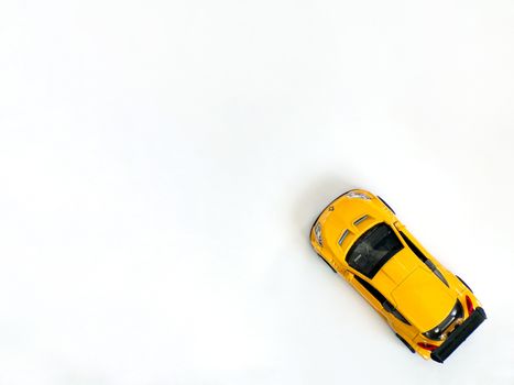 Toy car on a white background top view with copying space. Model of the renaulte machine. The car is isolated on a white background.