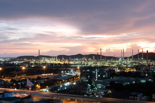 The Oil refinery and petrochemical plants Steel pipe equipment at sunrise background