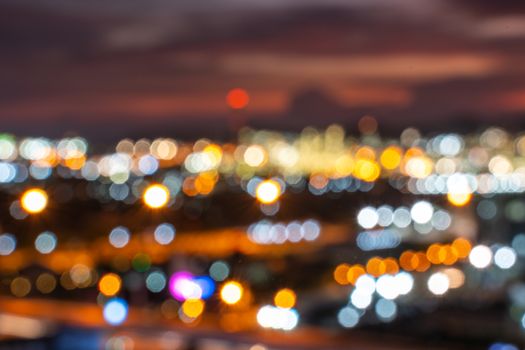 colorful bokeh lights from lamp over city, in vintage film color style