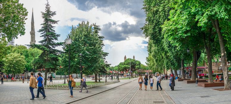 Istambul, Turkey – 07.12.2019. Many tourists walk around Sultan Ahmet Park on the site of a former Hippodrome in Istanbul, Turkey, on a cloudy summer day