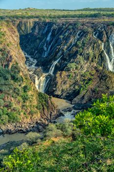 landscape of Ruacana Falls on the Kunene River in Northern Namibia and Southern Angola border, Africa wilderness landscape