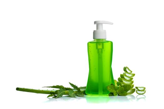 Bottle of liquid soap or cream or face wash dispensers with aloe vera, neem and basil leaf isolated on white background.