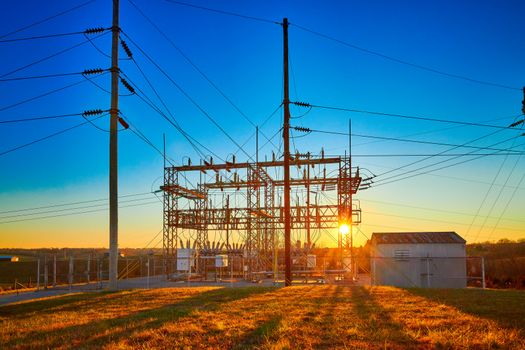 Electric Substation at Sunset with blue sky.