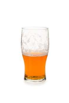 Pint glass half empty islated against white background.
