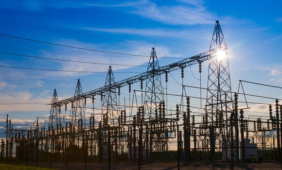 Sunset behind substation towers.