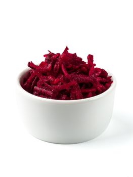 Grated beetroot in ceramic bowl. Shredded beet root salad isolated on white