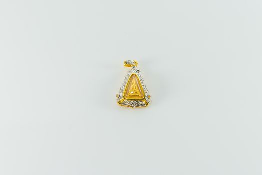 Amulet surrounded by diamonds on white background.