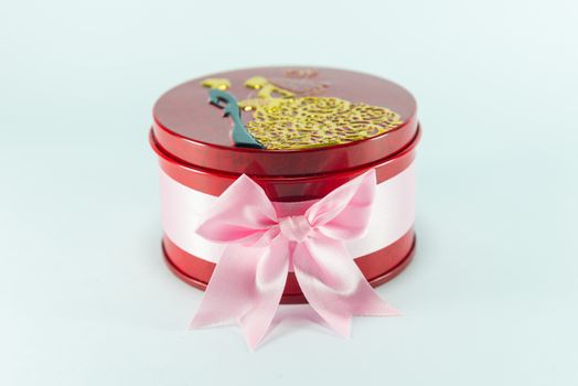 Box of red spheres on white background.