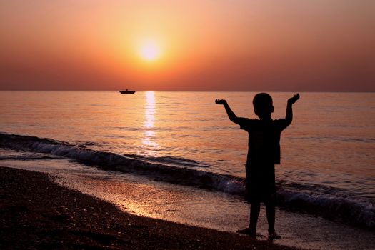 Little boy at sunrise